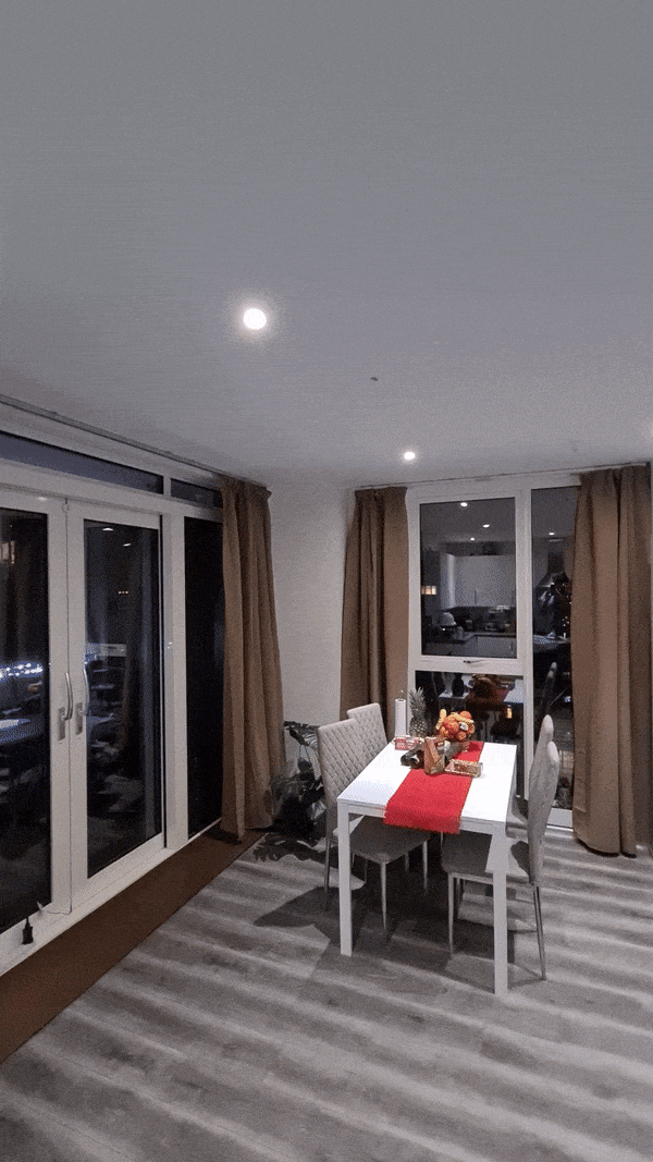 Curtains closing automatically to avoid glare on the TV screen.